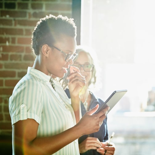 woman looking at ipad